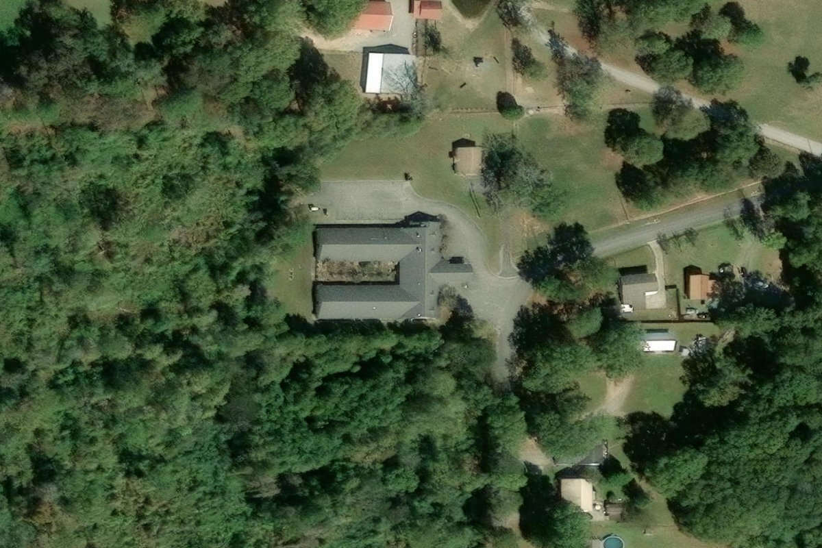 Wooded grounds around Village East — Village East Pell City